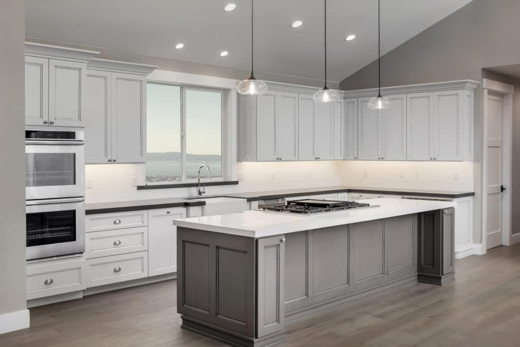 Grey and white cabinets, white countertops