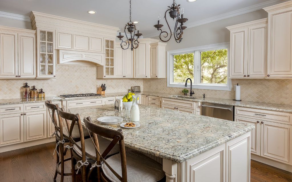 Kitchen portfolio design with beige cabinets and granite countertops