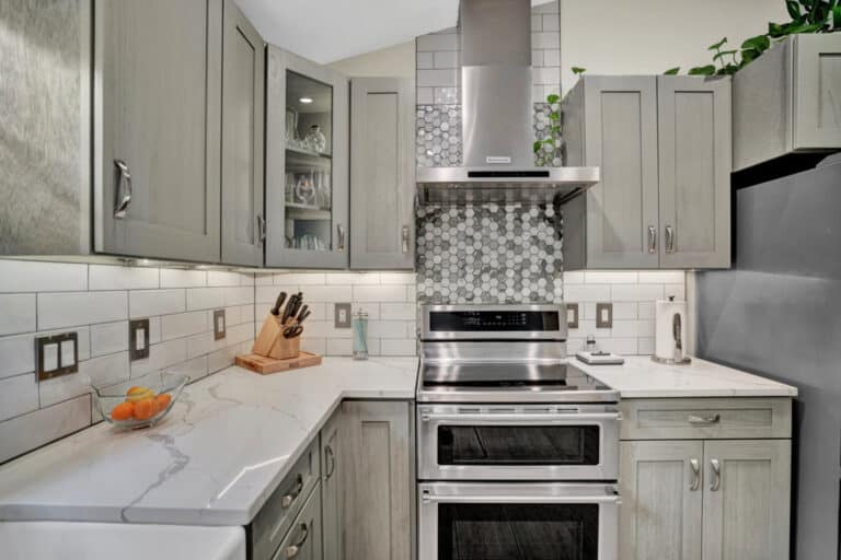 Farmhouse style kitchen project in Stafford VA with gray shaker cabinets, white countertops