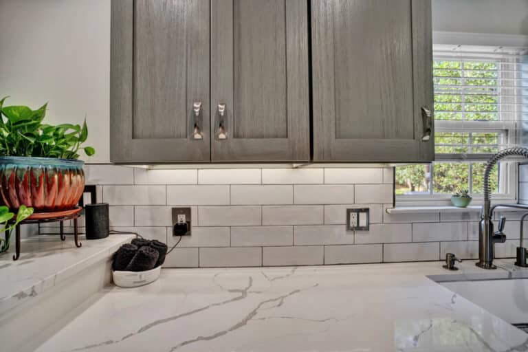 Farmhouse style kitchen project in Stafford VA with gray shaker cabinets, white countertops, white tiles backsplash