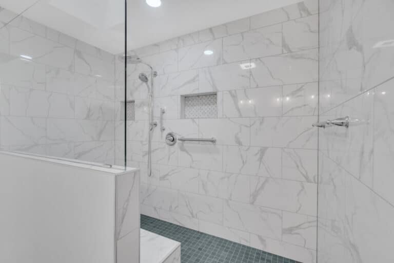 Shower with white surround, with bench