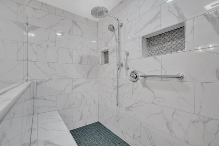 Shower with white surround, with bench