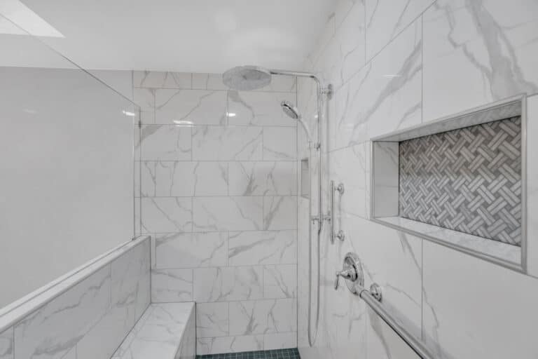 Shower with white surround, with bench