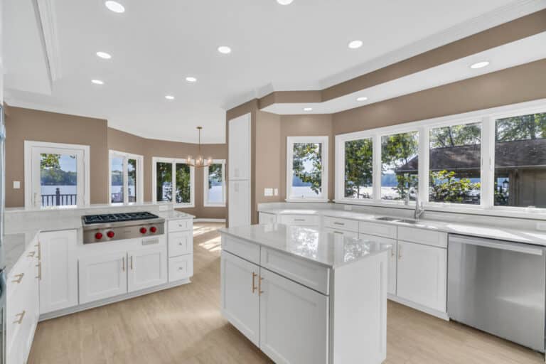 Brown kitchen project in locust grove va with white cabinets with glass door on wall cabinets, and white countertop