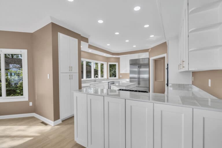 Brown kitchen project in locust grove va with white cabinets with glass door on wall cabinets, and white countertop