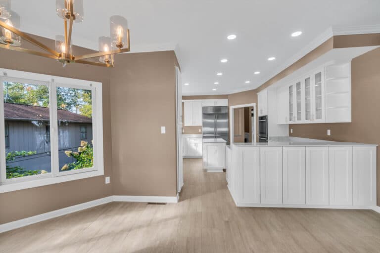 Brown kitchen project in locust grove va with white cabinets with glass door on wall cabinets, and white countertop