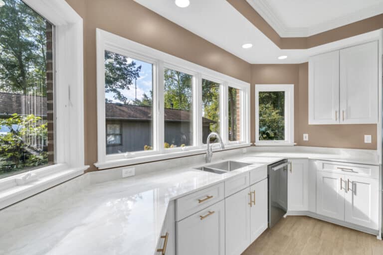 Brown kitchen project in locust grove va with white cabinets with glass door on wall cabinets, and white countertop