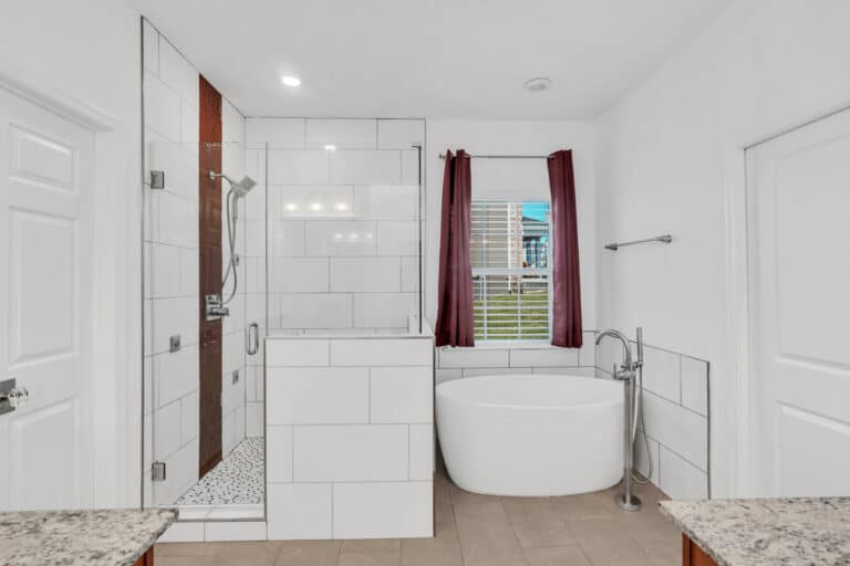 Shower with white tiles surround, and tub