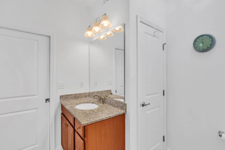 Brown vanity with granite countertop