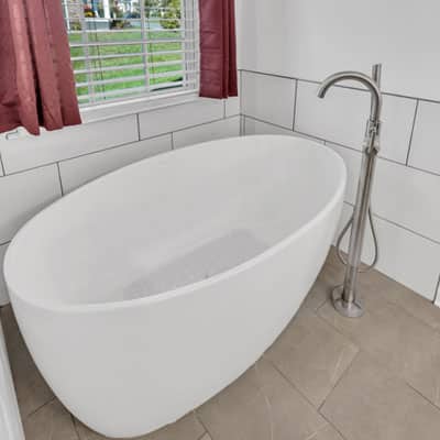 Tub with stainless faucet