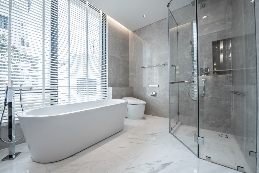 Elegant bathroom with shower, tub, and toilet