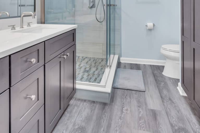 Gray shaker vanity, wood flooring