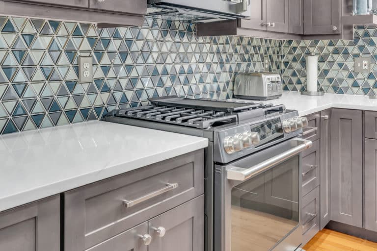 Gray shaker cabinet with white countertop