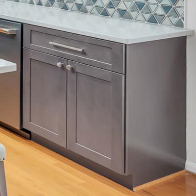 Gray base shaker cabinets, wood flooring