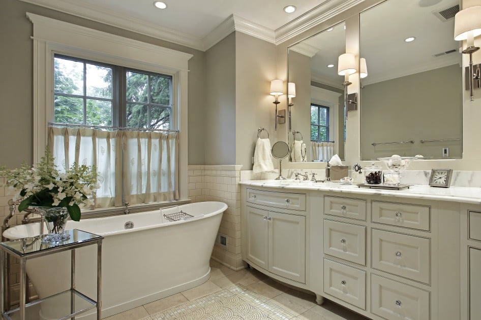 Bathroom with grey vanity and tub