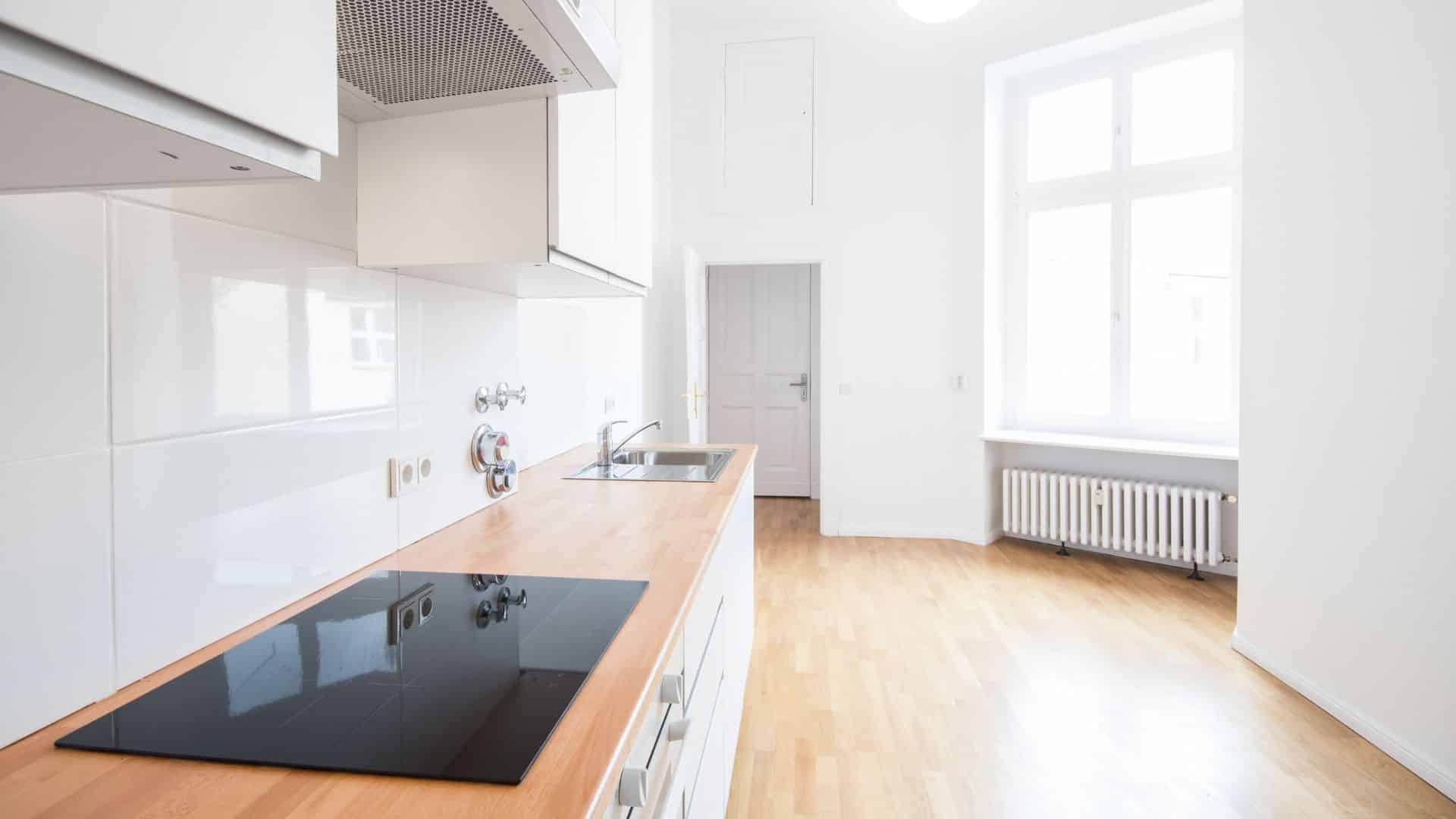 White kitchen with brown countertop