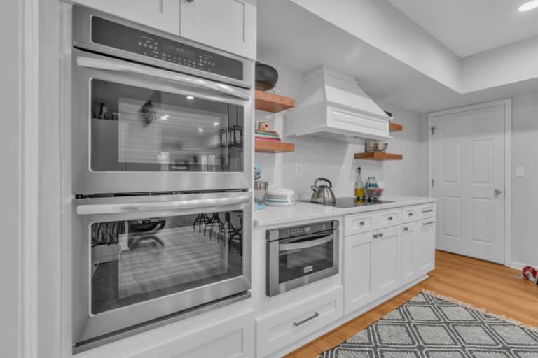 Kitchen appliances on white cabinets