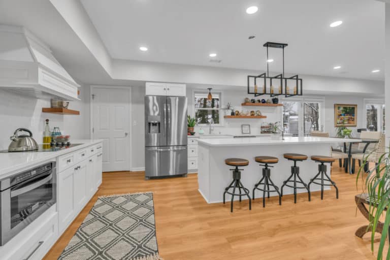 Spacious, open-concept kitchen with white shaker cabinets