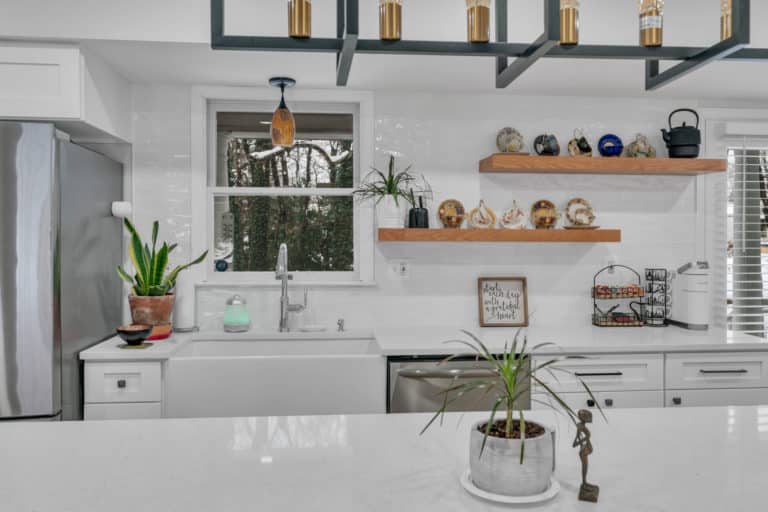 Open-shelving cabinets on white countertop