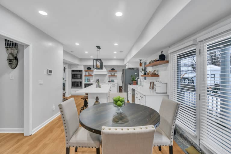 kitchen project in waldorf with wood flooring, white countertop and cabinets