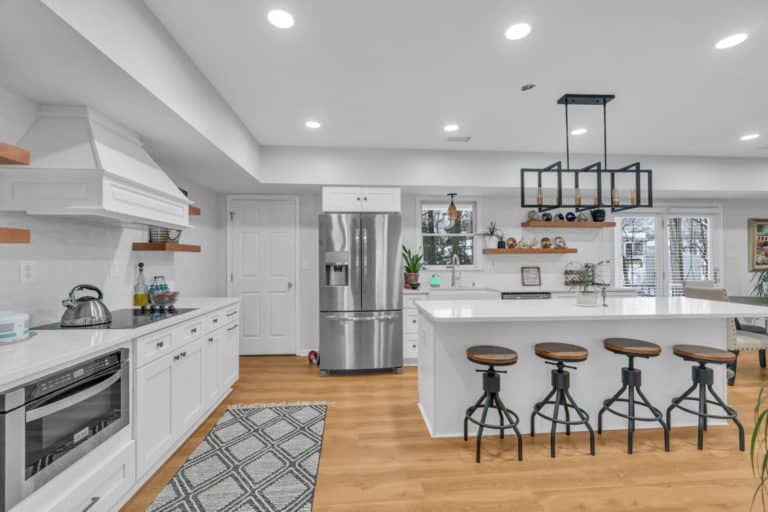 kitchen project in waldorf with wood flooring, white countertop and cabinets