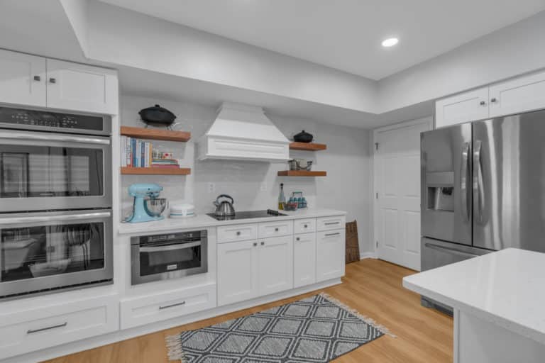 kitchen project in waldorf with wood flooring, white countertop and cabinets