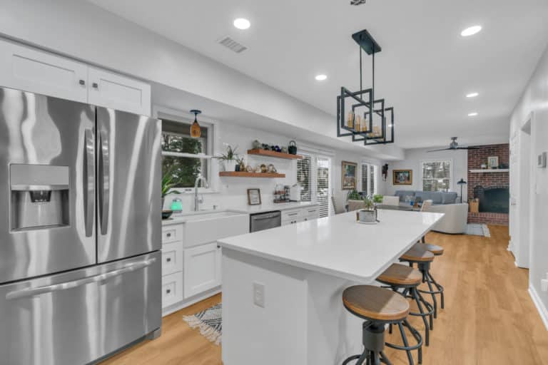 kitchen project in waldorf with wood flooring, white countertop and cabinets