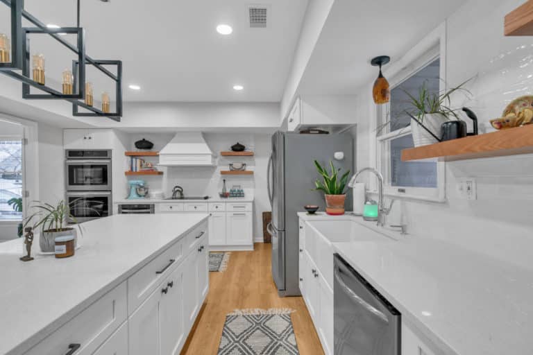 kitchen project in waldorf with wood flooring, white countertop and cabinets