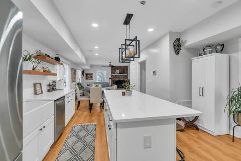 Spacious kitchen with white cabinets