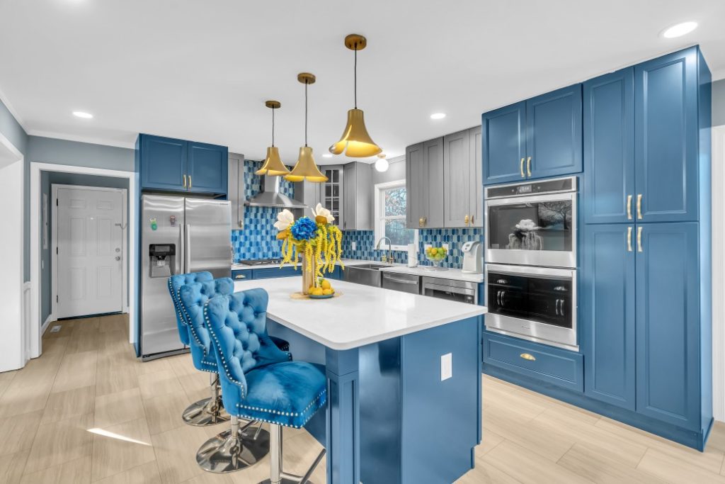 kitchen project in waldorf md with blue cabinets, white countertops, wood flooring