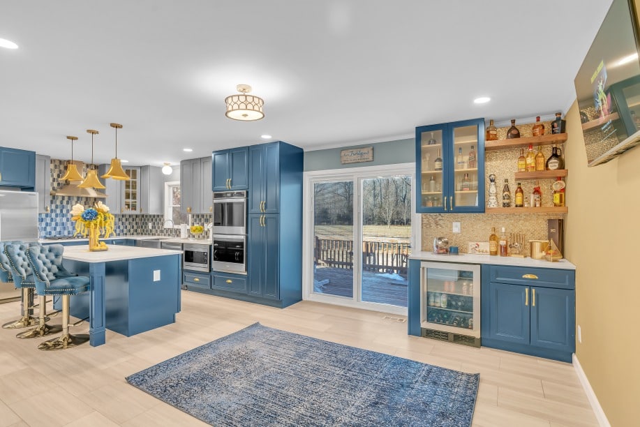 kitchen project in waldorf md with blue cabinets, white countertops, wood flooring