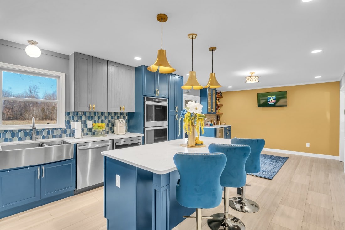 kitchen project in waldorf md with blue cabinets, white countertops, wood flooring. 5 Remodeling Ideas To Maximize Your Small Kitchen In Friendly MD