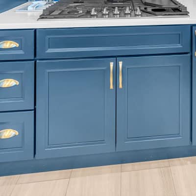 Blue doors and drawer on base cabinet