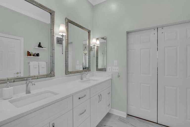 white vanity with square mirrors