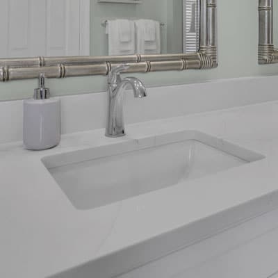 Silver faucet and undermounted sink