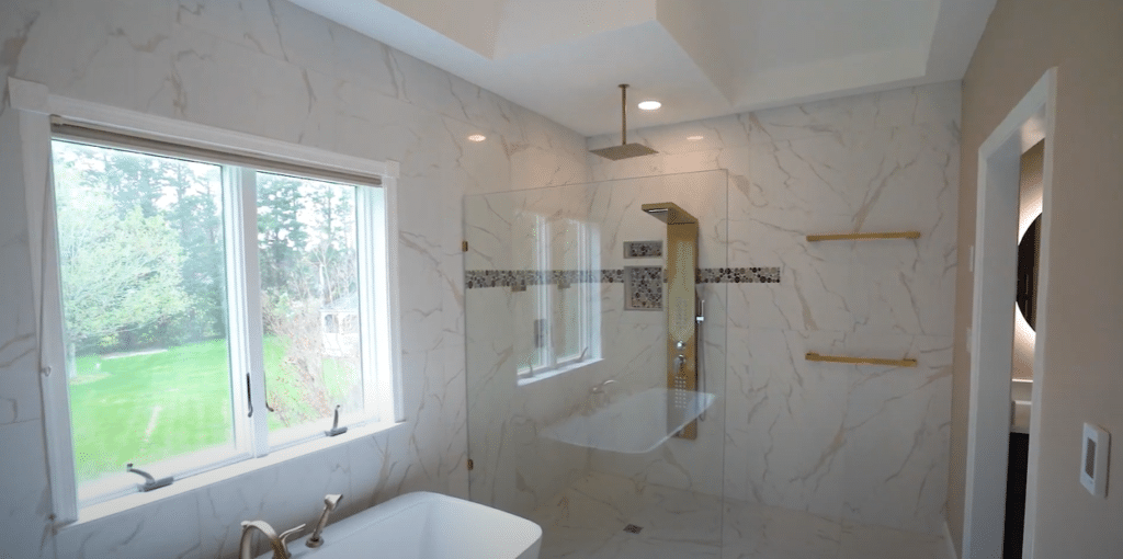 White bathroom renovation project clifton md with walk-in shower