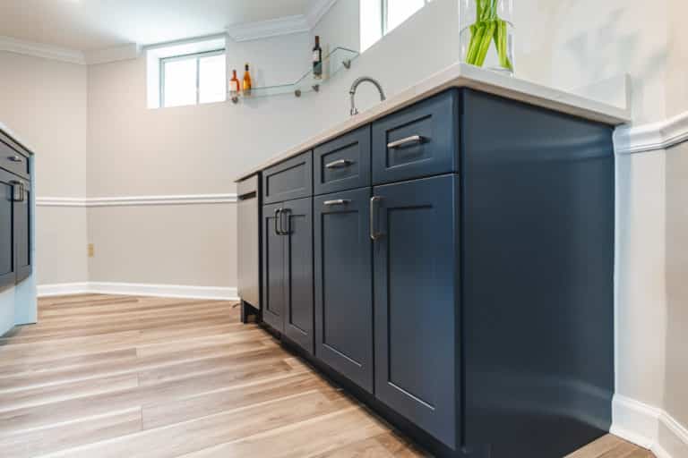 Basement bar with blue shaker cabinet