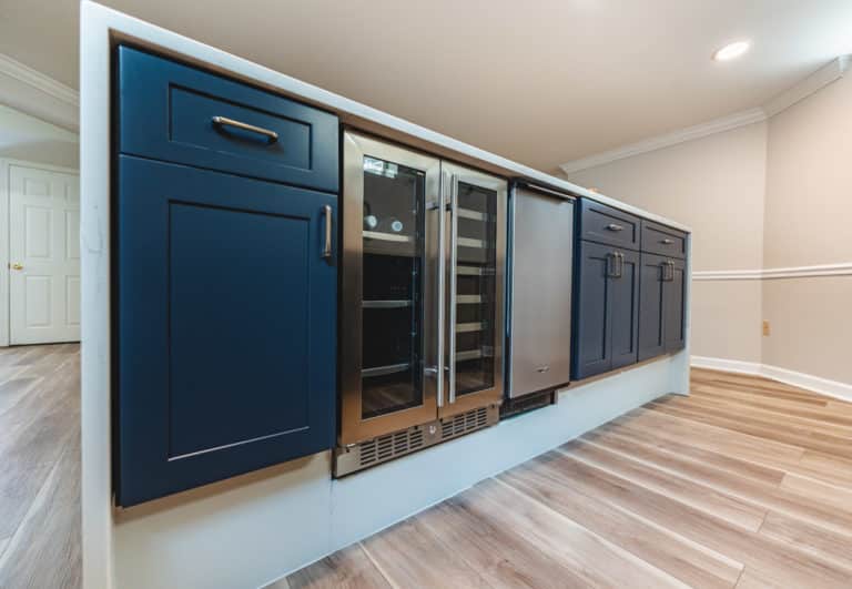 Basement bar with blue shaker cabinet