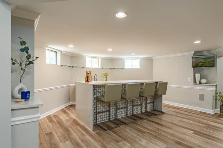 Basement bar with island and white countertop