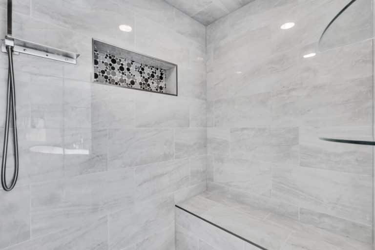 Shower with gray tiles surround