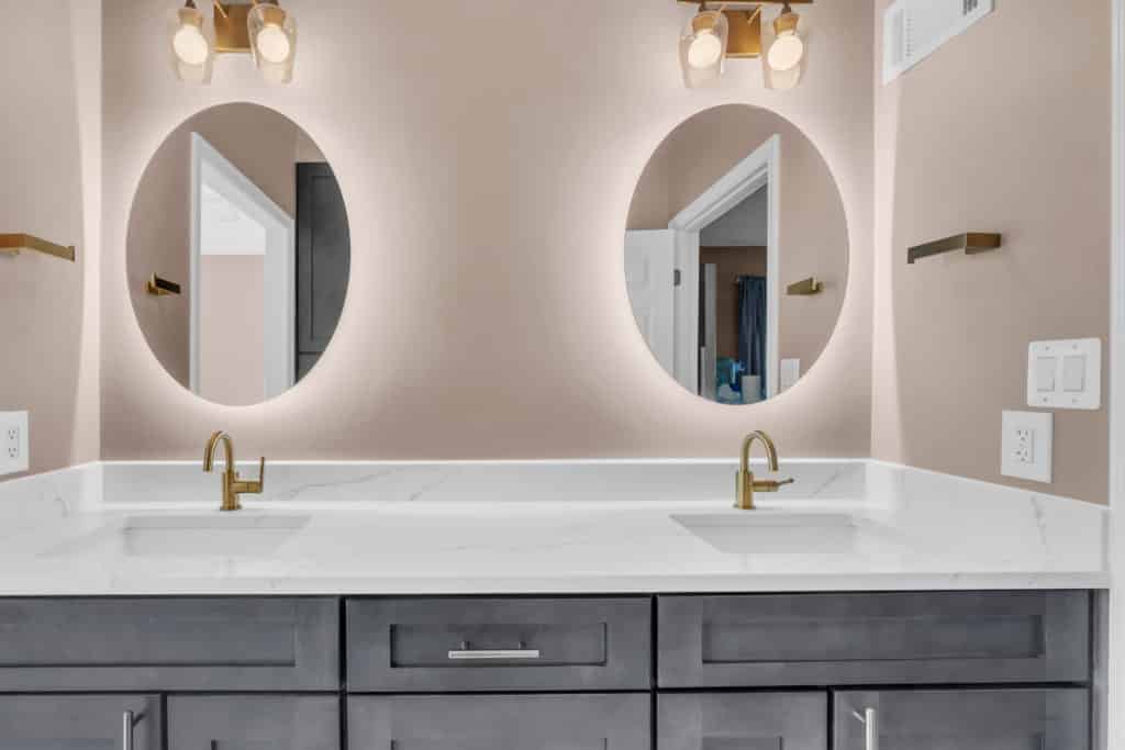 Elegant double sink brown vanity with round mirrors