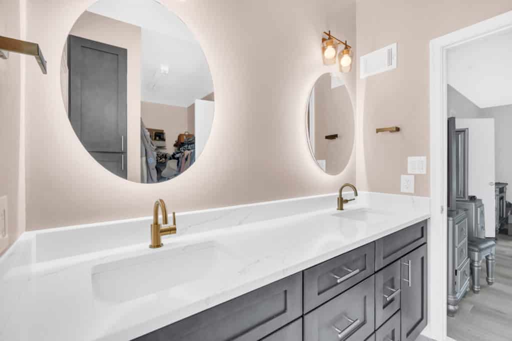 Elegant double sink brown vanity with round mirrors