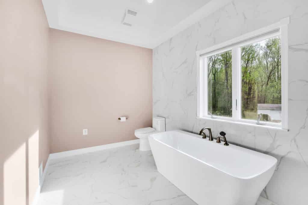 Luxurious bathroom with white flooring