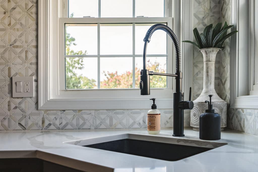 Sink and faucet on white countertop