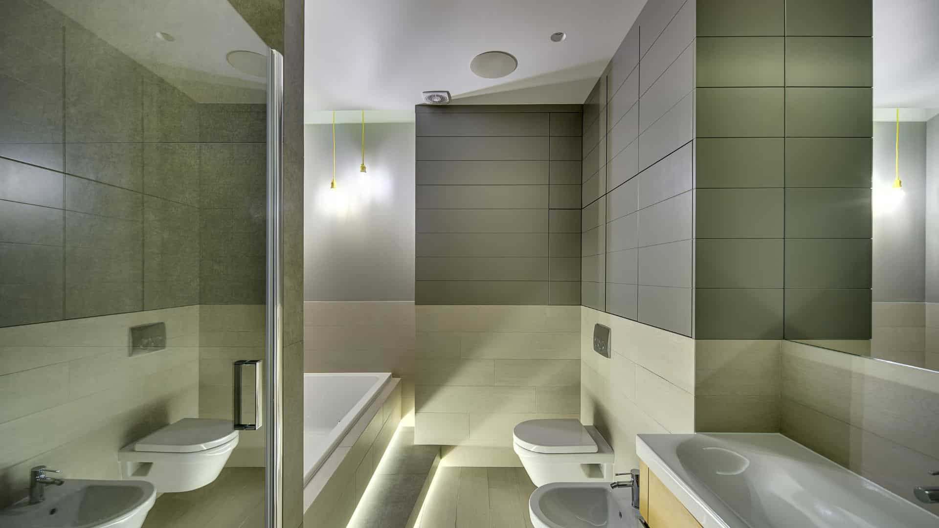 Elegant bathroom with ceiling speaker for spa-like feels