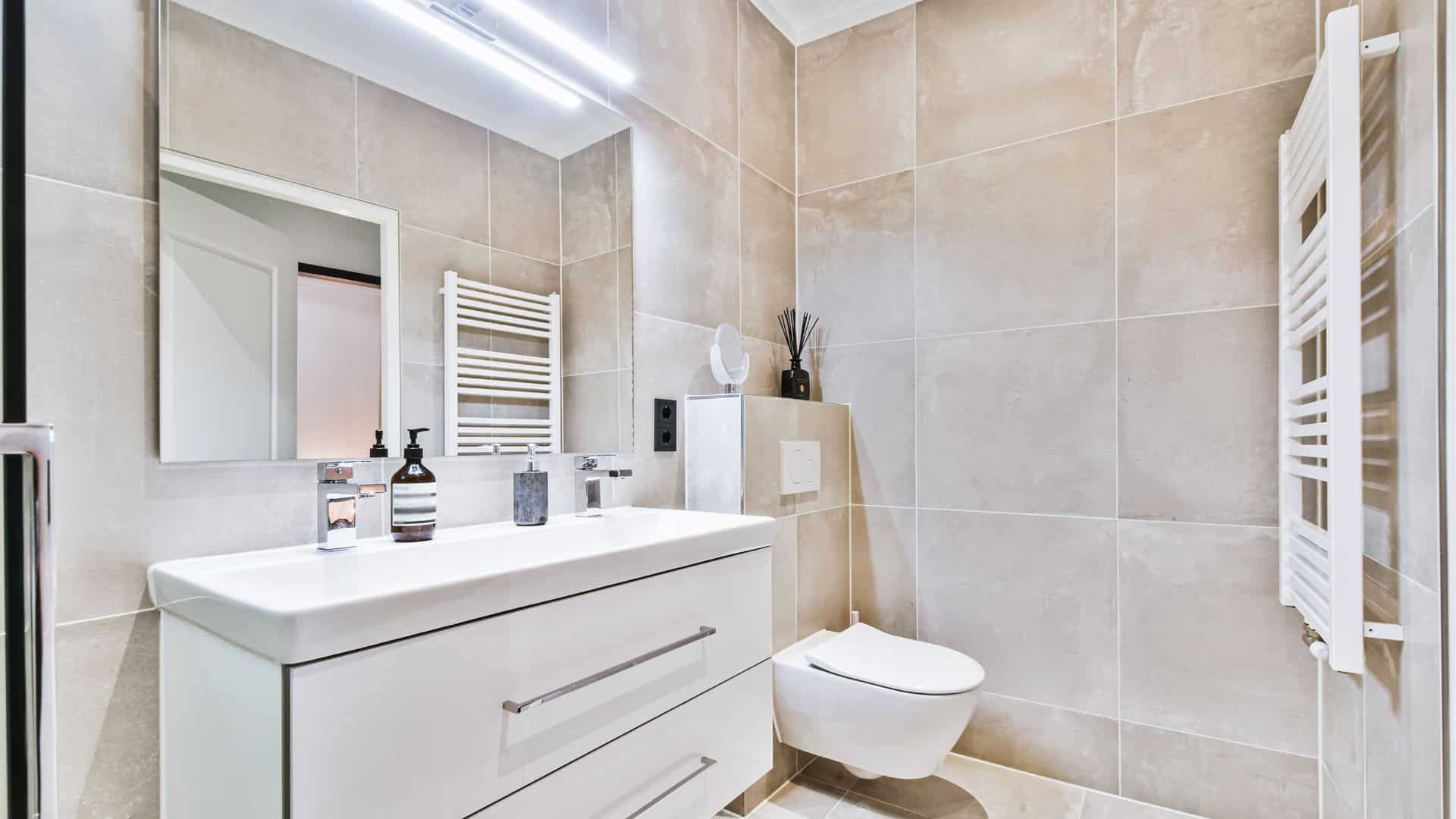 Small bathroom style with white vanity, and toilet