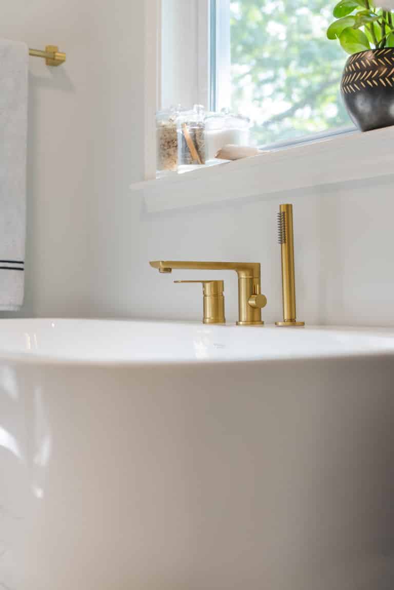 Tub with gold faucet