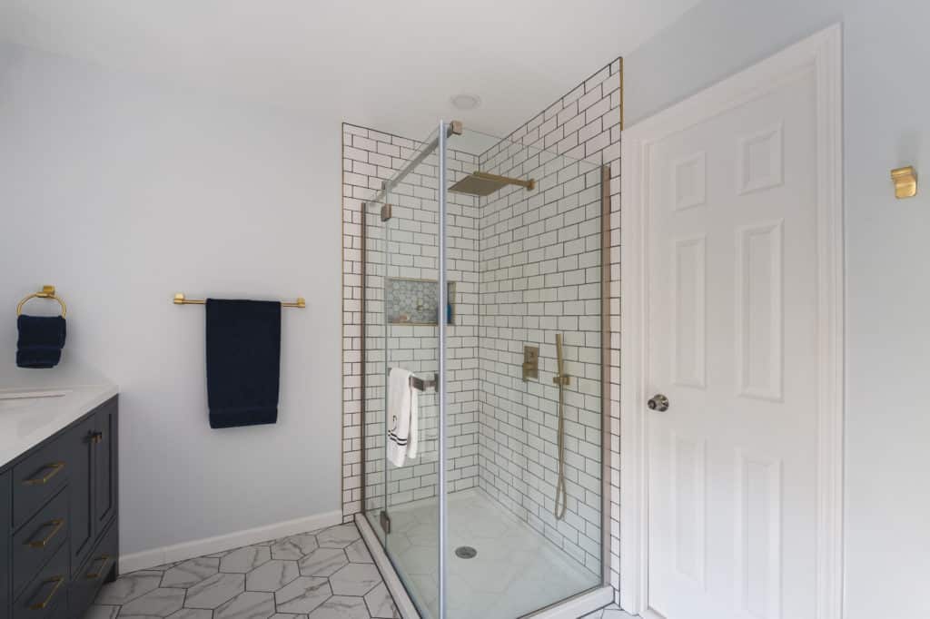 White Bathroom Remodeling Project in Stafford VA with walk-in shower, and textured flooring