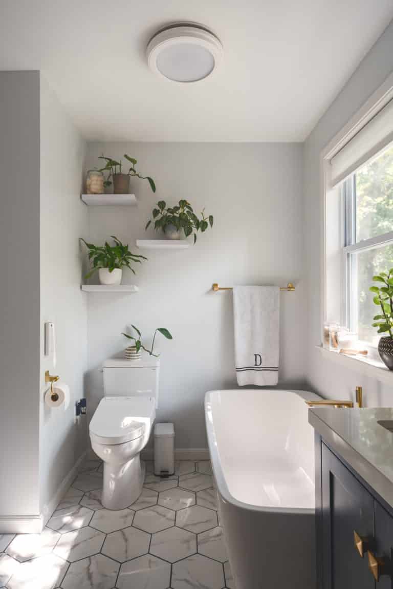 White Bathroom Remodeling Project in Stafford VA with navy vanity, tub, and textured flooring