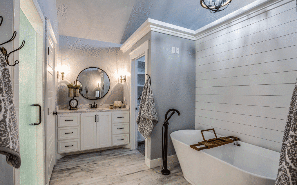 Bathroom with tub and shower, and white vanity